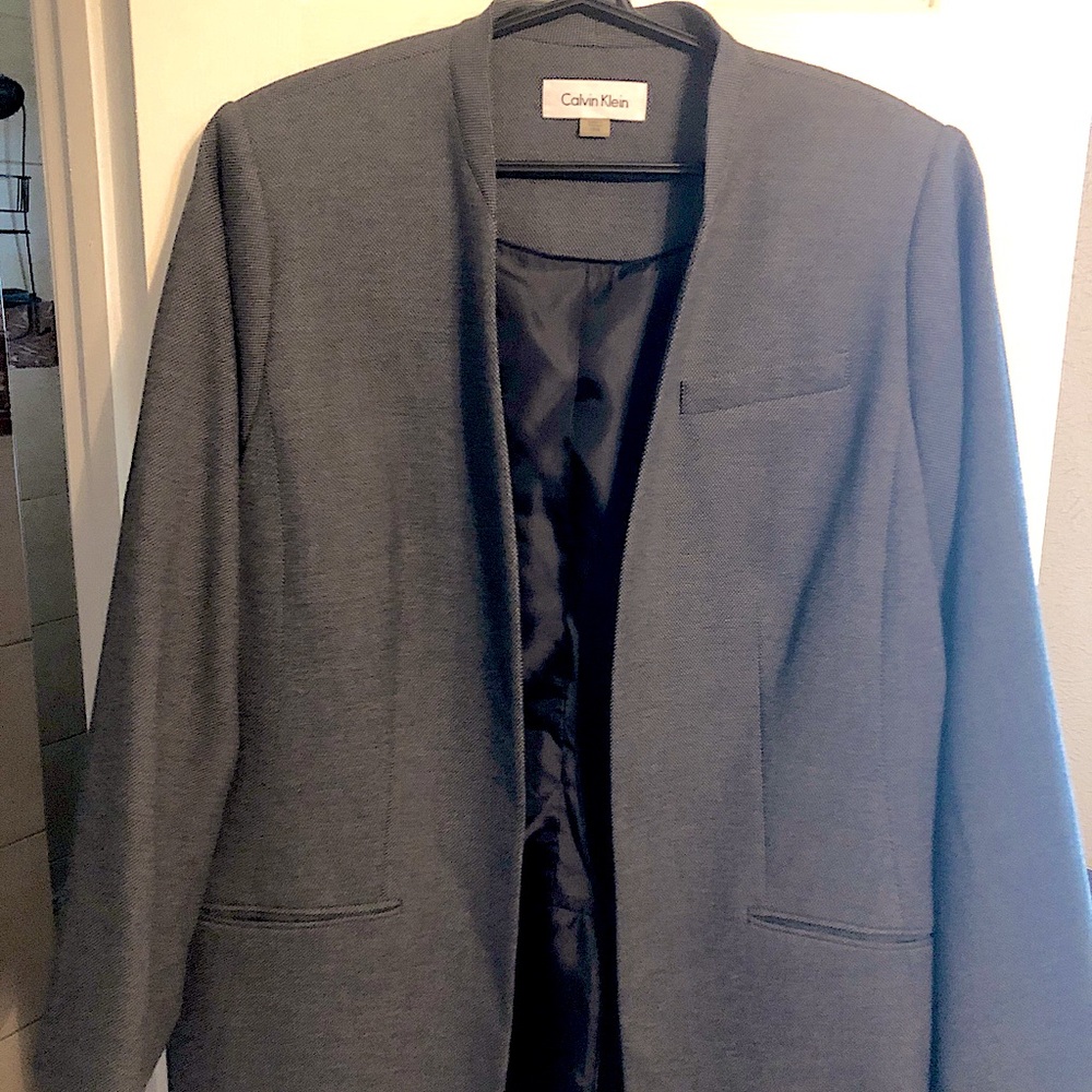 Quality Calvin Klein work blazer. Unique style. Long length bottom. Lined.